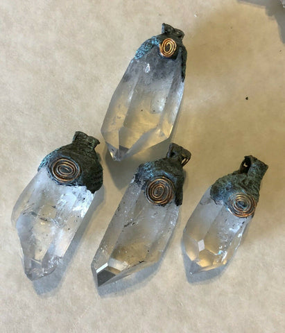 Raw Quartz Crystal between 1 3/4 in to 2 in with natural copper patina bail